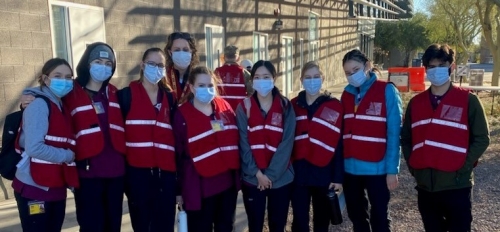 Edson College students pose before starting their shift at a COVID-19 vaccination site in the East Valley