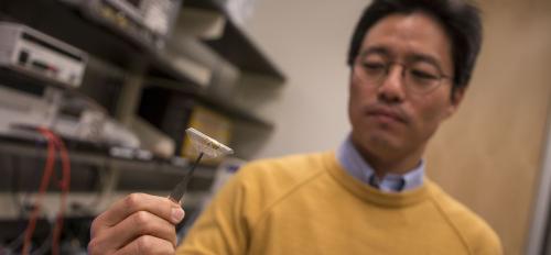 Junseok Chae holds a prototype of a wireless, fully passive neural recorder.