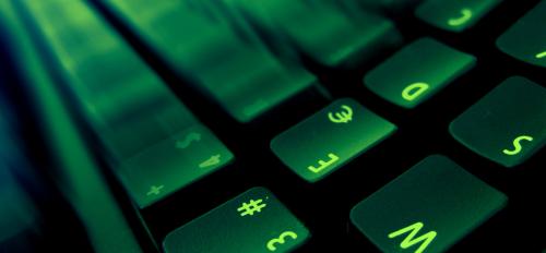 Image of a keyboard lit with green light
