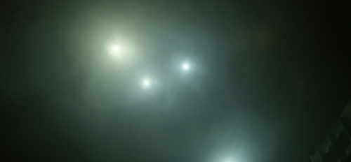Mysterious lights in a cloudy night sky