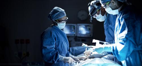 surgeons operating on person