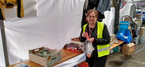 ASU faculty member Jessica Hirshorn puts together to-go bags of food for Ukrainian refugees at the Warsaw Central Train Station in Poland.