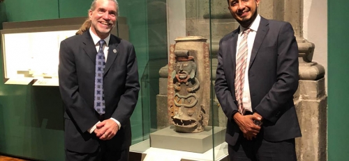 Joel Palka and collaborator, archaeologist Josuhé Lozada, next to the repatriated Maya urn from Albion College on exhibit in Mexico City.