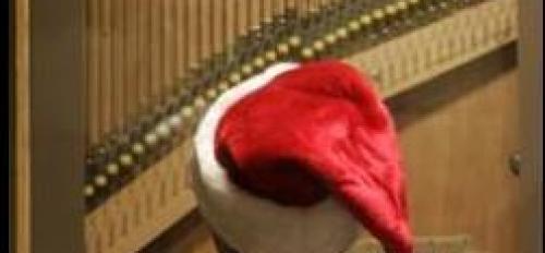 person wearing a Santa hat playing a carillon