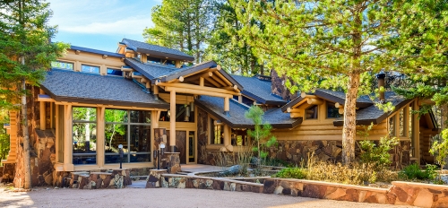 A large log home sits among the Ponderosa pines near Payson.