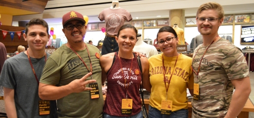 An ASU family poses inside the Sun Devil Marketplace during a recent Family Weekend 