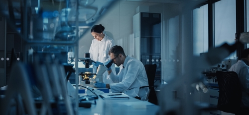 A man and a woman work in a medical research lab