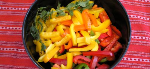 A bowl of sliced peppers.