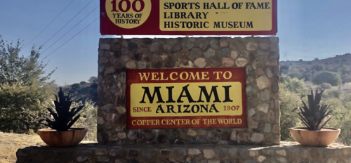 Image of the Miami, Arizona welcome sign. Stating "one mile long, 100 years of history" 