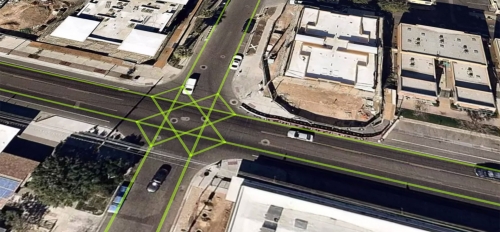 An arial image of an intersection with green gridlines overlaid on it