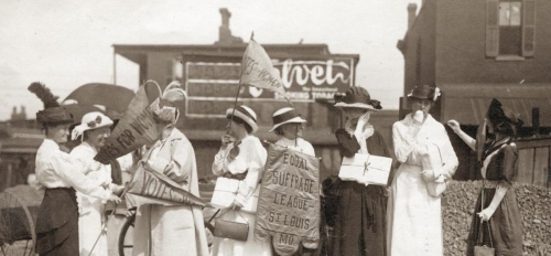 Archived photo of group of women traveling promoting women's suffrage rights.