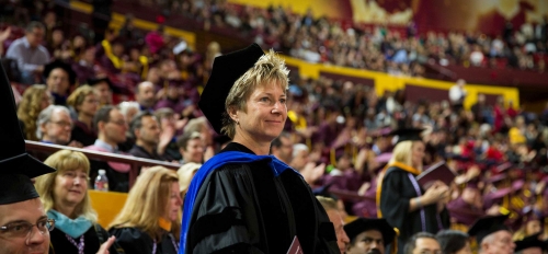 Mary Niemczyk stands at commencement