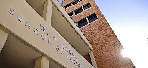 Exterior of a building with the words "W. P. Carey School of Business."
