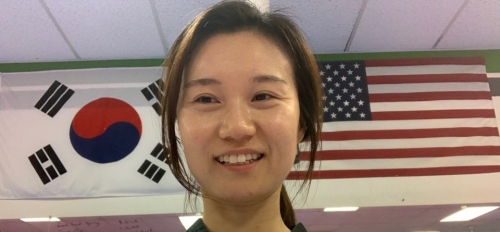 Graduating ASU student Young Wha Lee poses in her Taekwondo practice / Courtesy photo