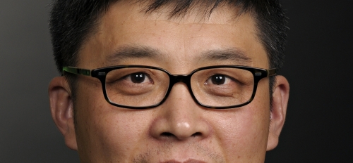 headshot of ASU professor John Zhang