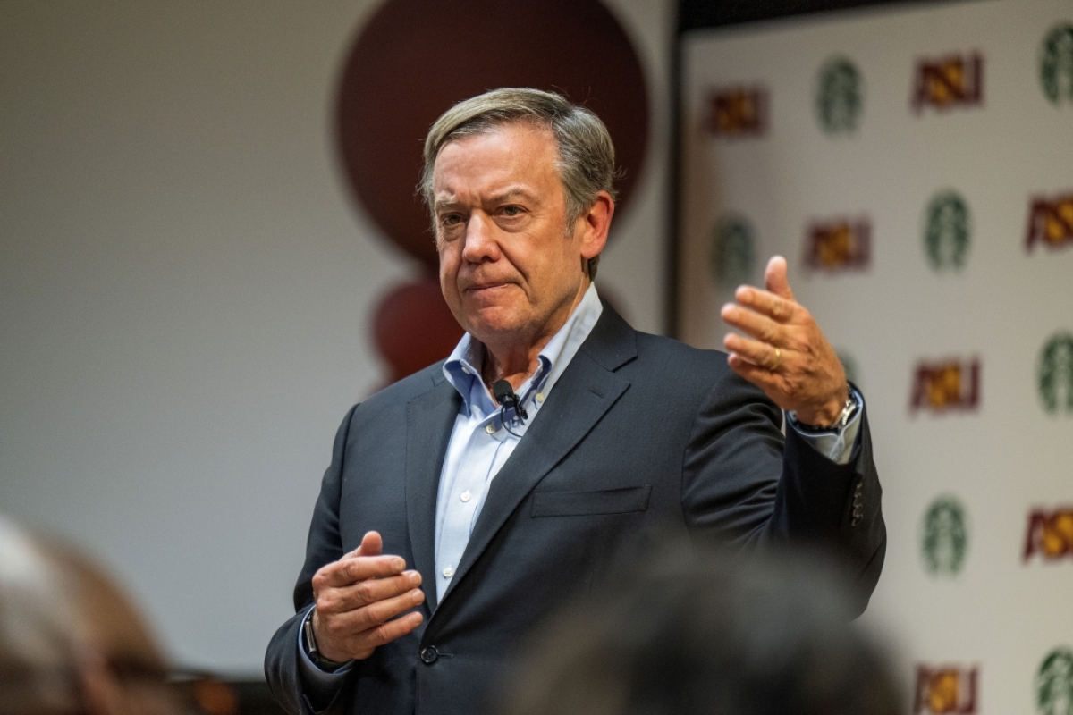 Michael Crow talking to audience at Starbucks graduation event