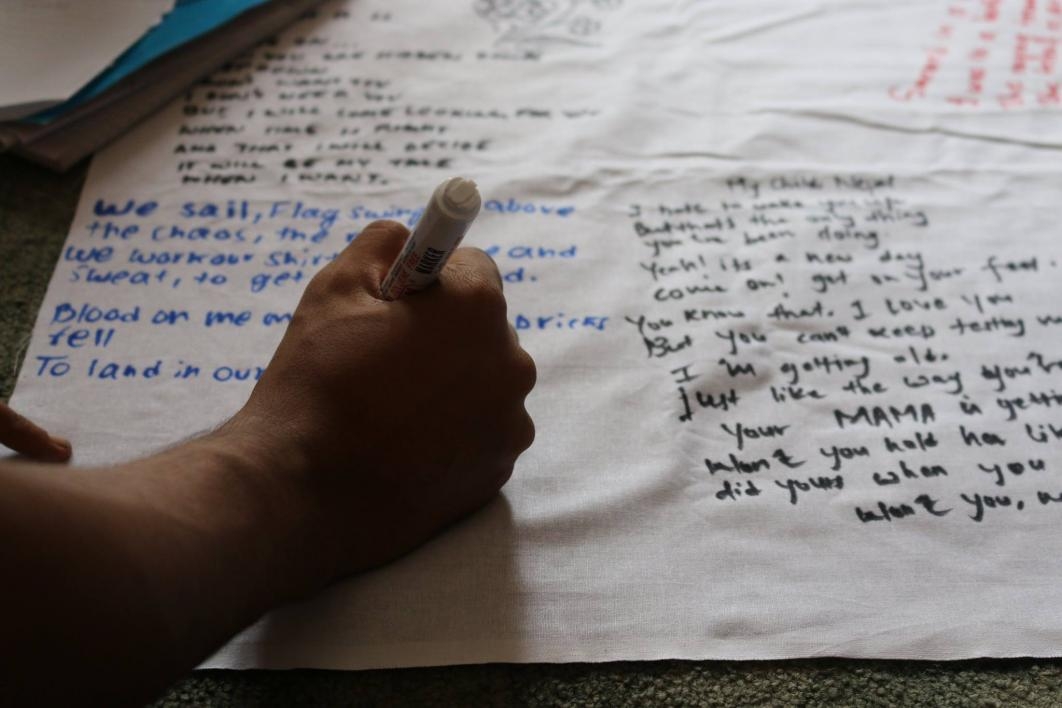 THe People of Nepal Writing Poetry on White Cloth