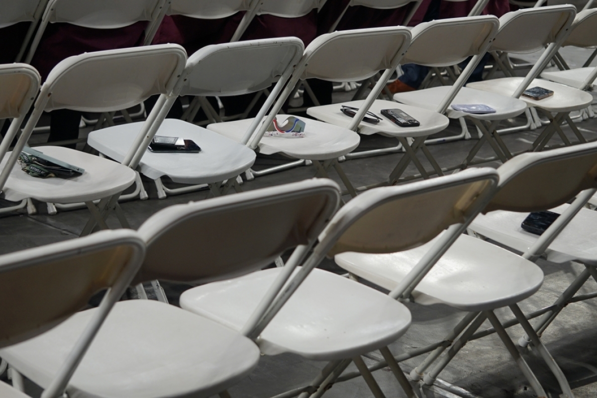 Cellphones are temporarily left on chairs during Watts College spring 2023 convocation