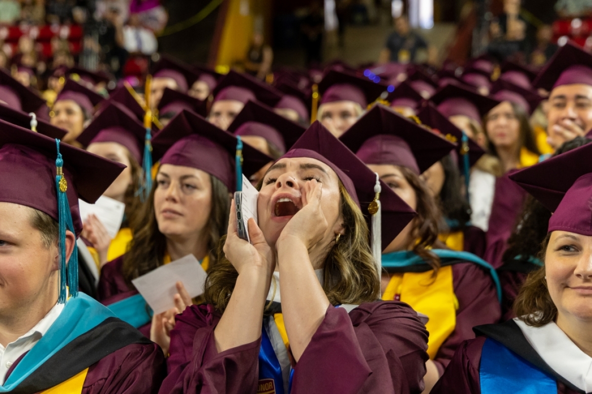 A graduate shouts with excitement at Watts College spring 2023 convocation