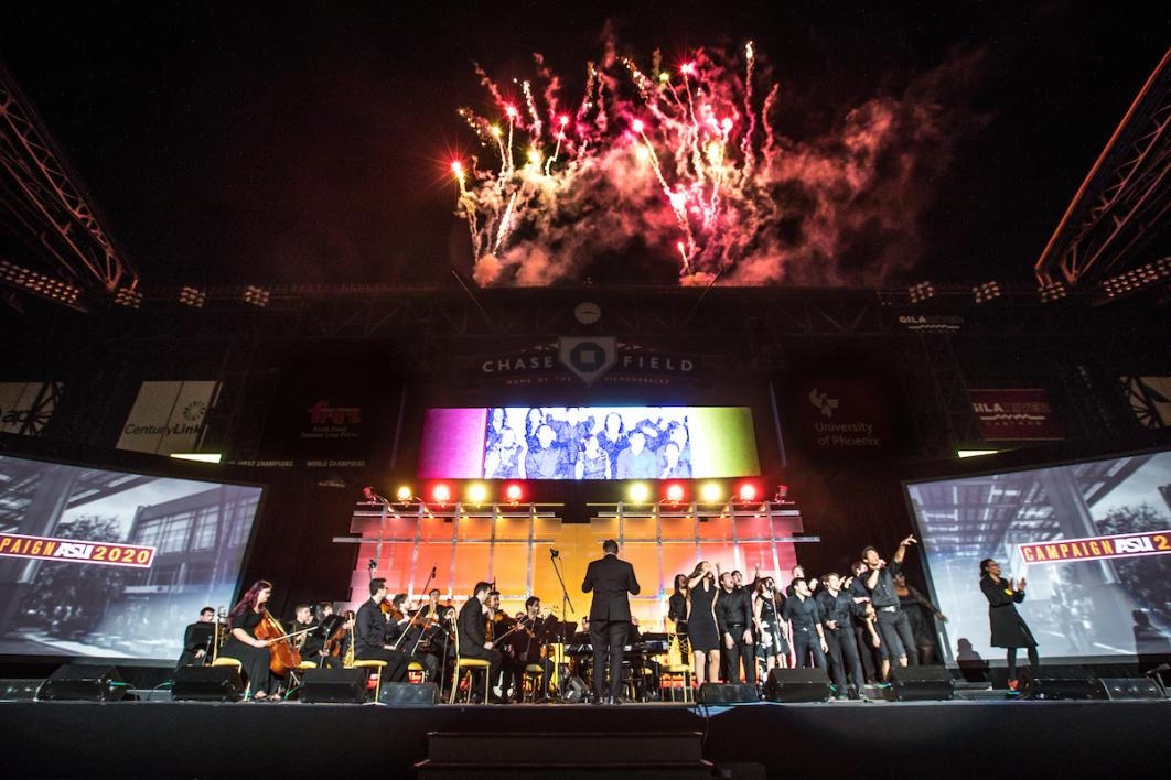 launch of event on stage with fireworks above stage