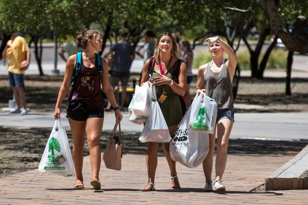 Students walk with shopping bags of dorm essentials