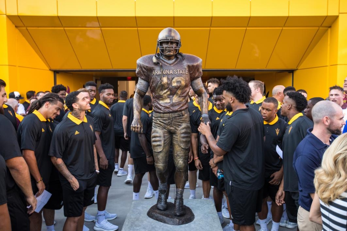 Football players check out the new Pat Tillman statue