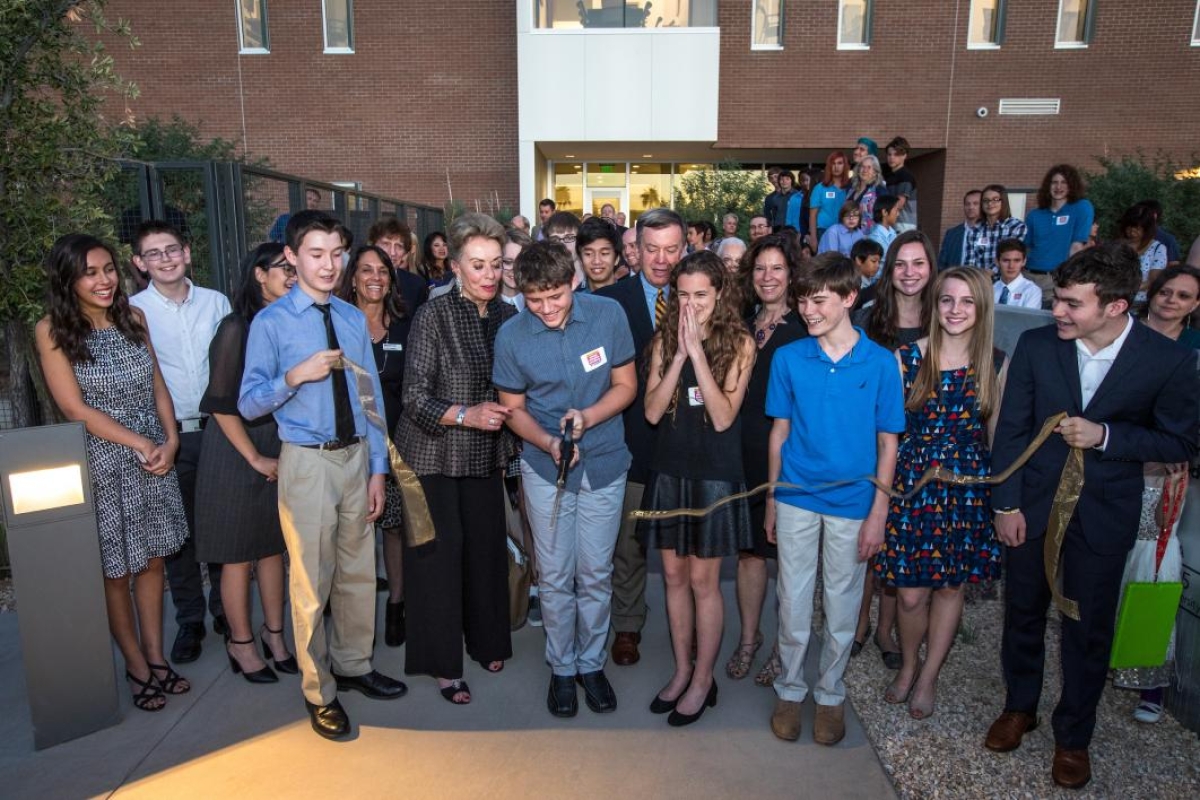 Students cut the ribbon at the opening of the Herberger Young Scholars Academy building