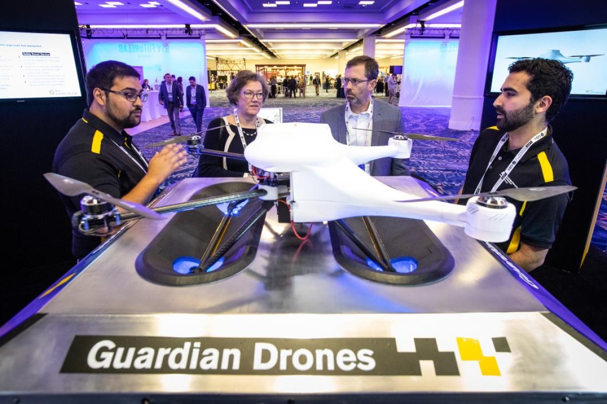 People examine a drone