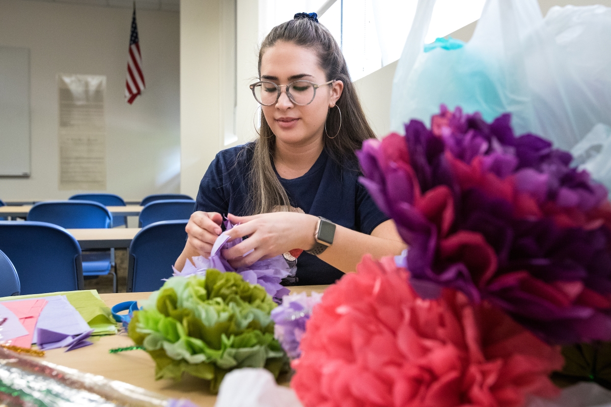 student making tissue paper flowers