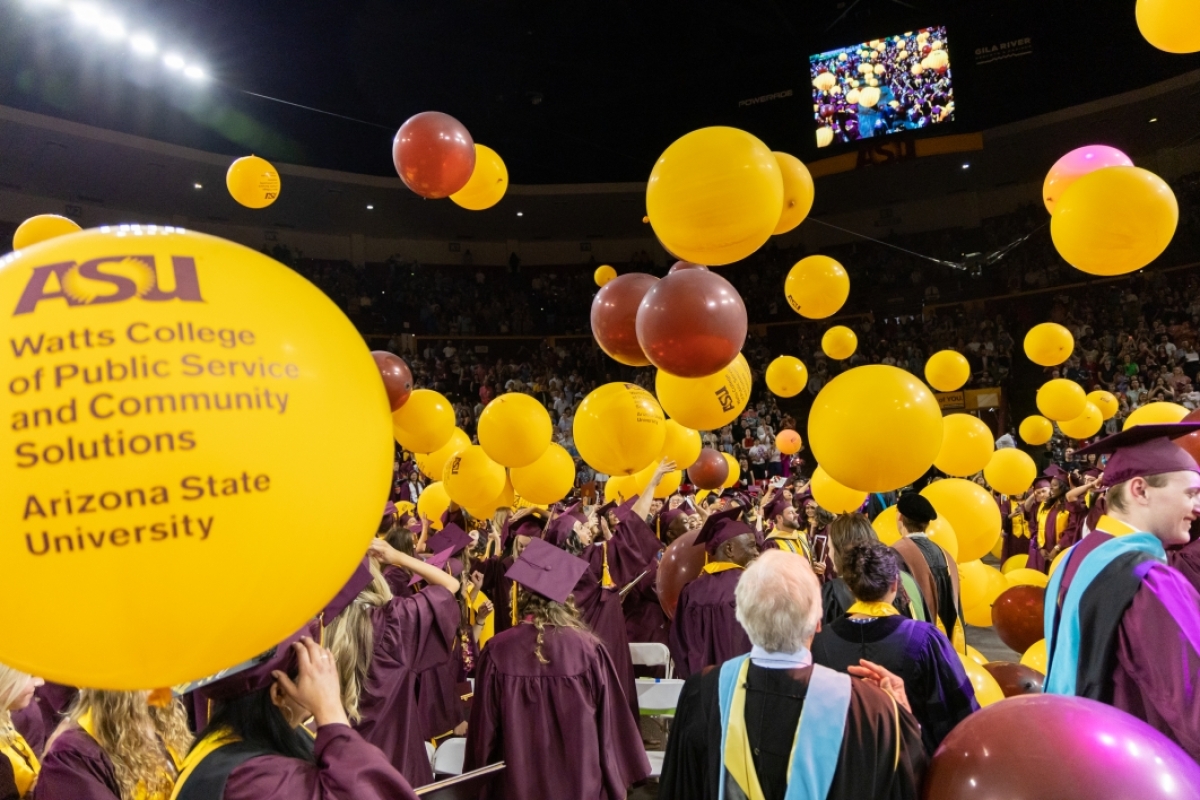 Graduates toss about balloons at Watts College spring 2023 convocation
