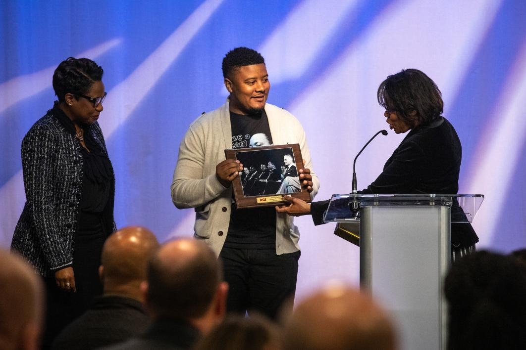 A man receives an award onstage