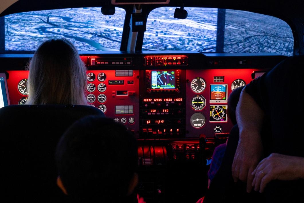 people in a flight simulator