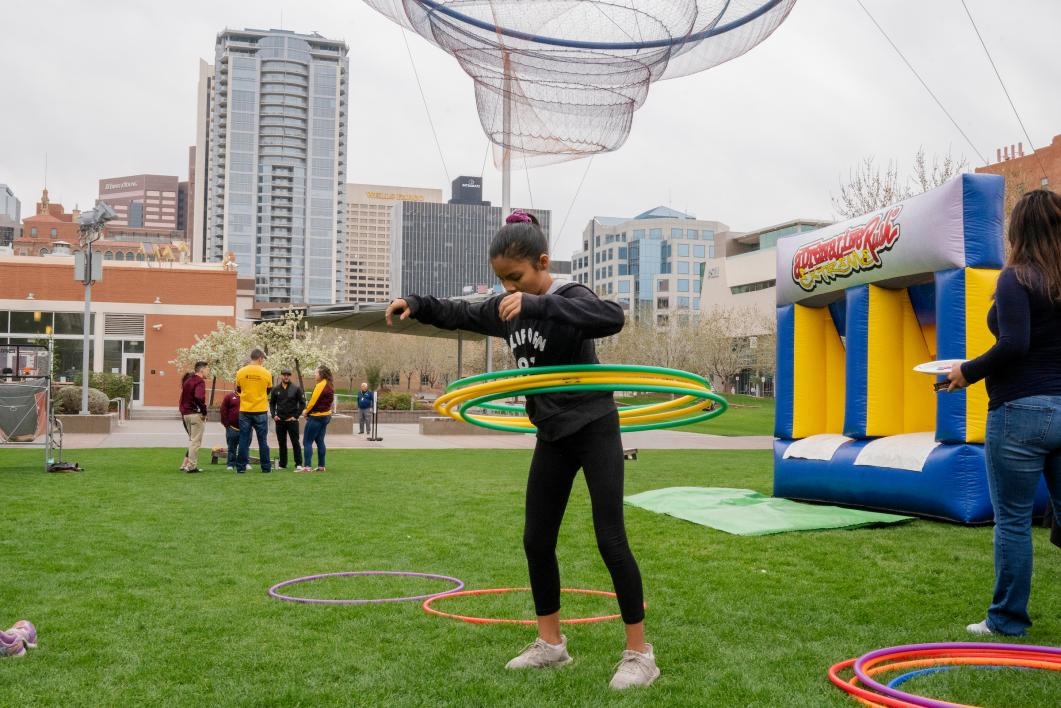 girl hula hoops in civic space park