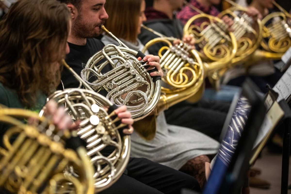 French horn players rehearse