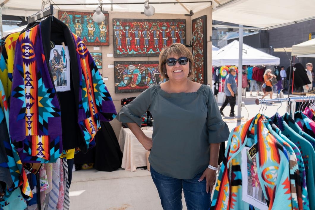 A vendor stands in her booth at the ASU Pow Wow