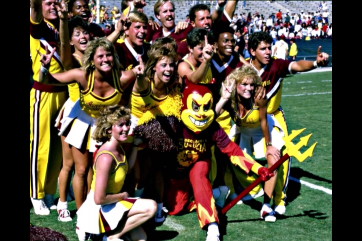 1985 photo of Sparky and cheerleaders