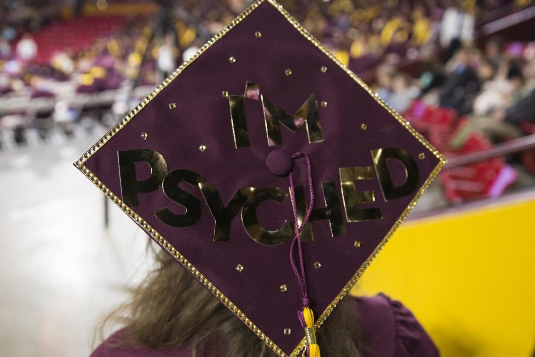 Graduation cap reads, "I'm psyched."