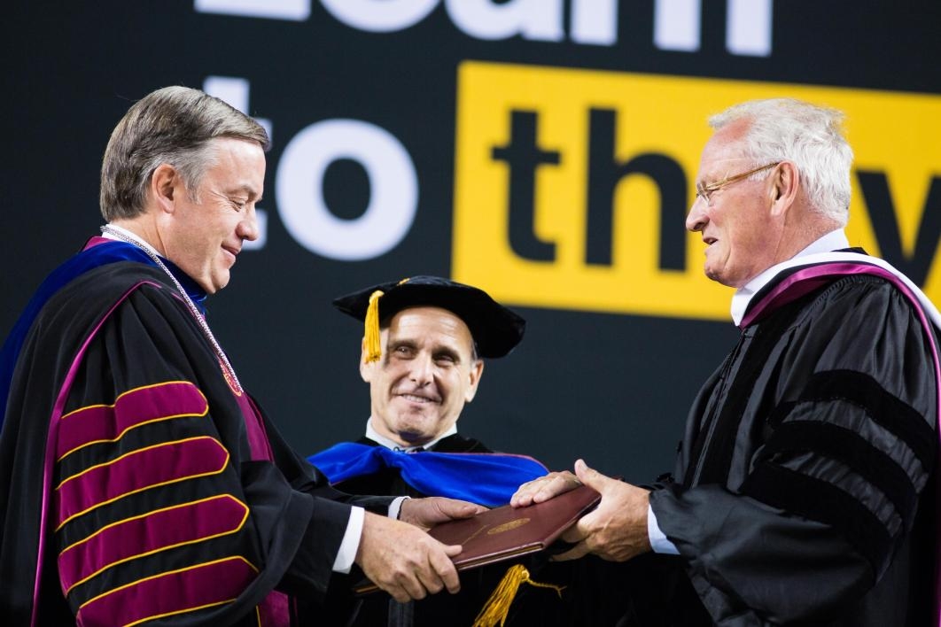 ASU President handing honorary degree to recipient