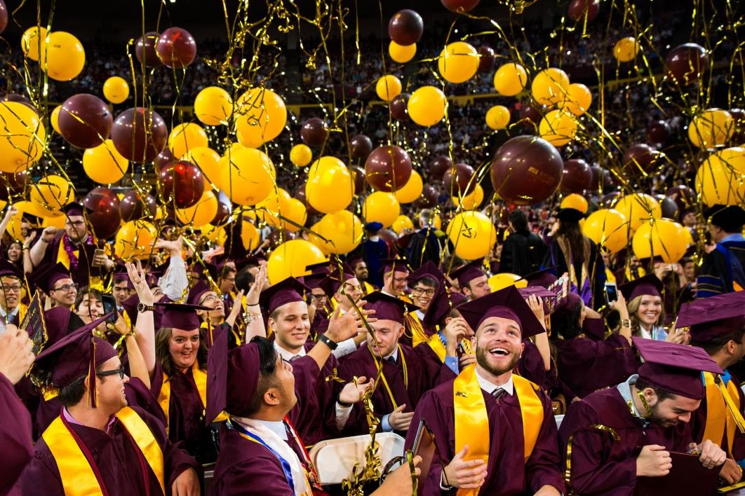 balloons dropping on graduates during convocation