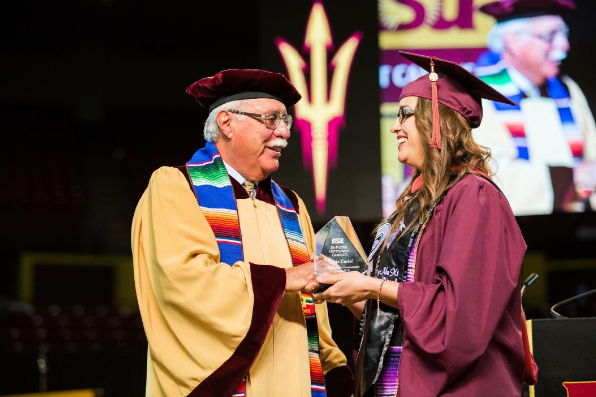 Ed Pastor shakes a new graduate's hand at the 2016 Hispanic Convocation