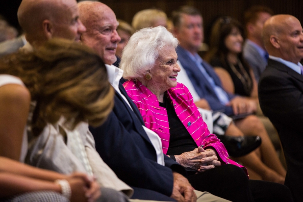 Sandra Day O'Connor laughs in an audience