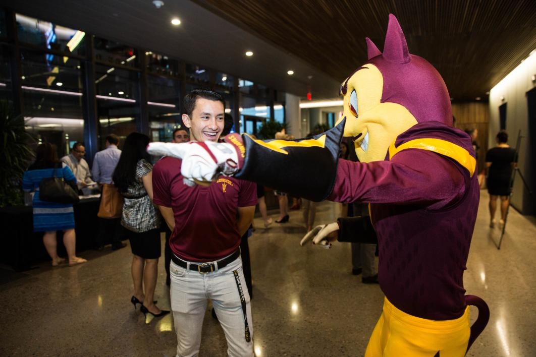 Sparky talks with visitors at the new law center opening.