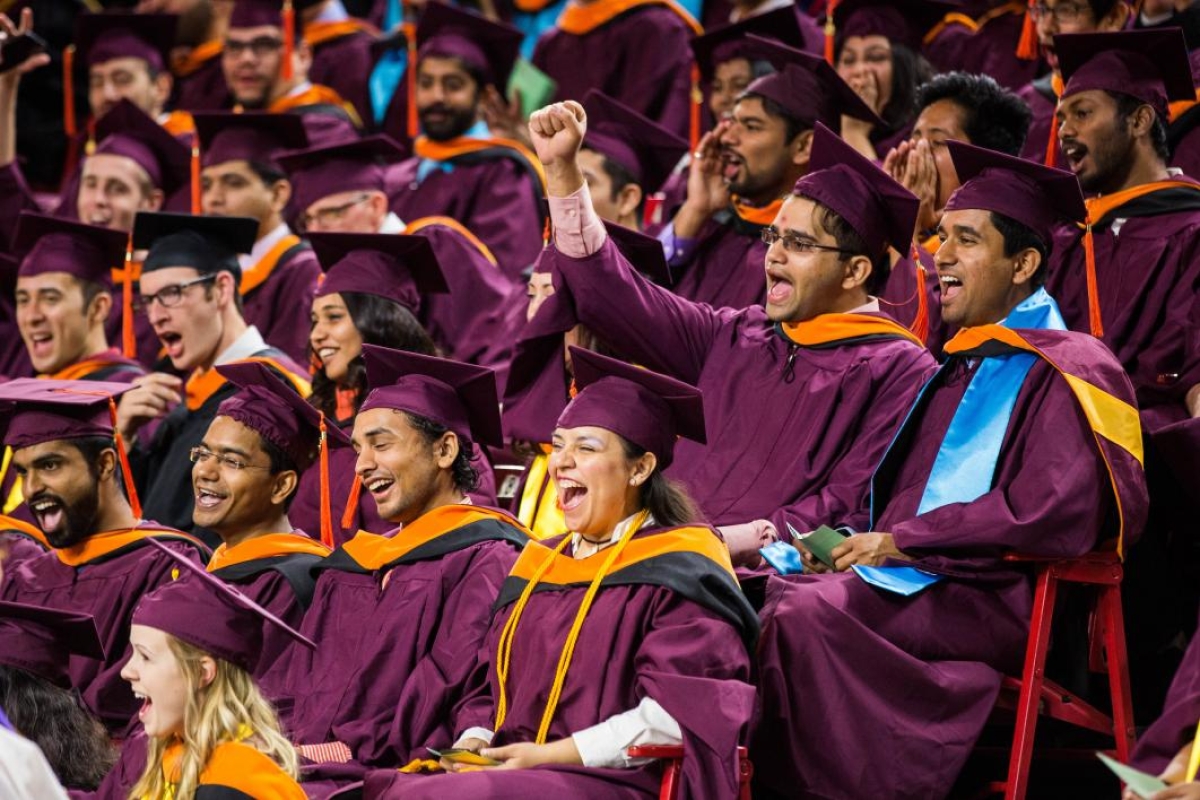 students cheering at graduation
