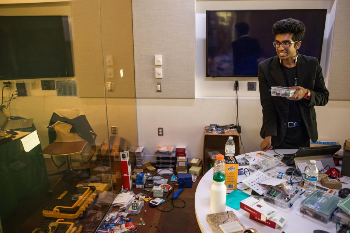 A staffer works the hardware-checkout room at the hackathon