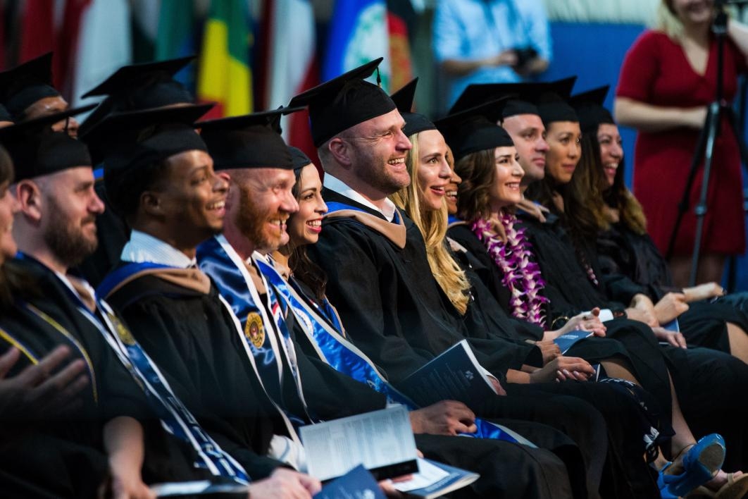 The audience laughs at the Thunderbird School of Global Management commencement