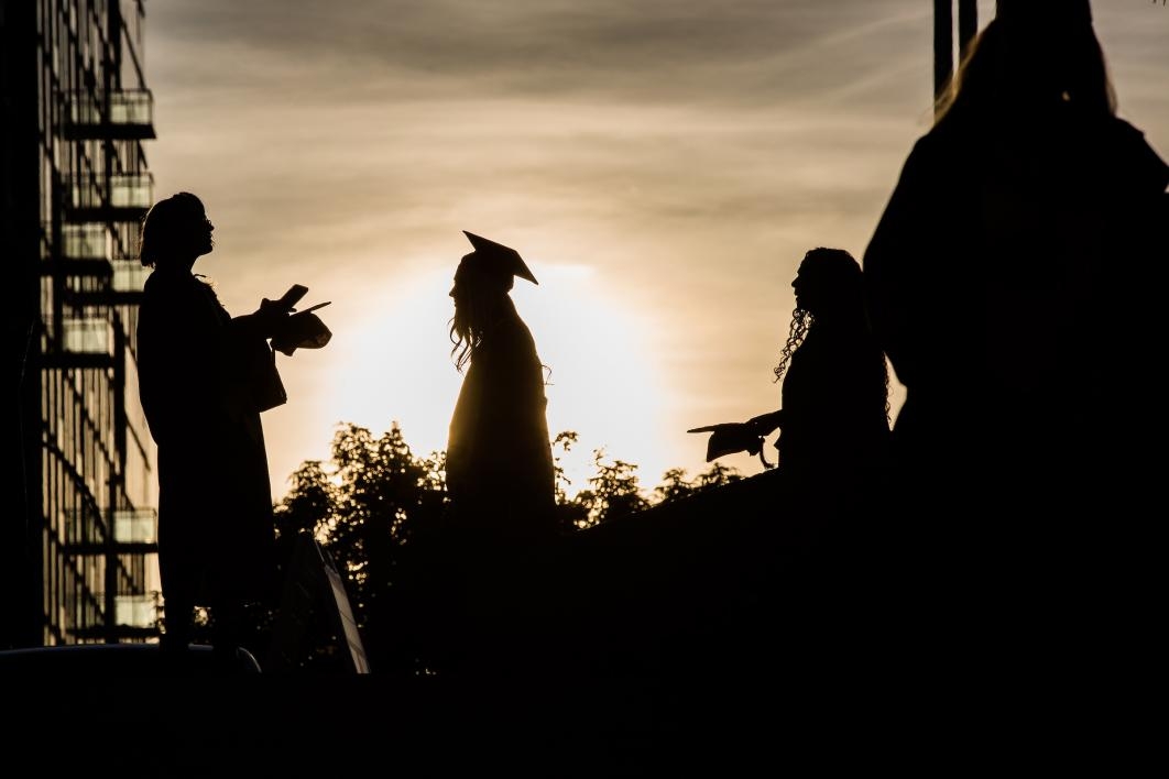 silhouettes of graduates