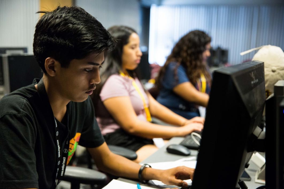 San Carlos Secondary School senior James Talgo works with his teammates on their website focused on substance abuse during ASU's Inspire program.
