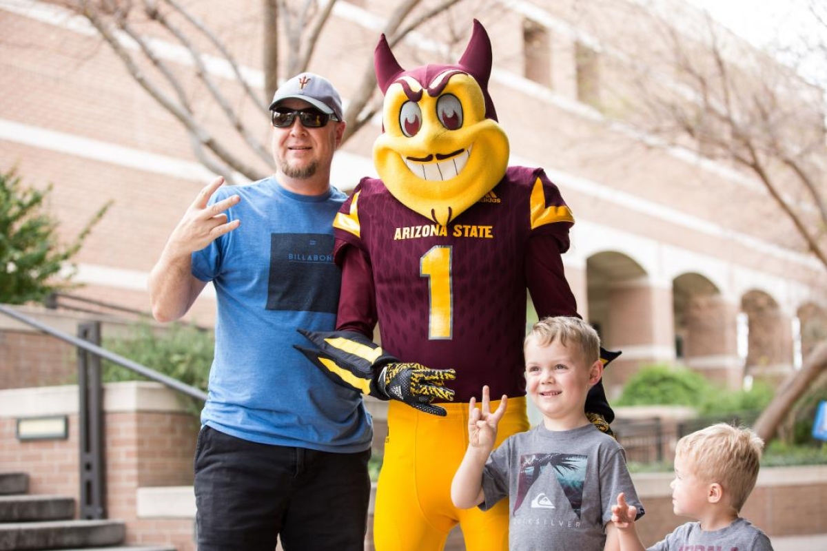 family posing with Sparky
