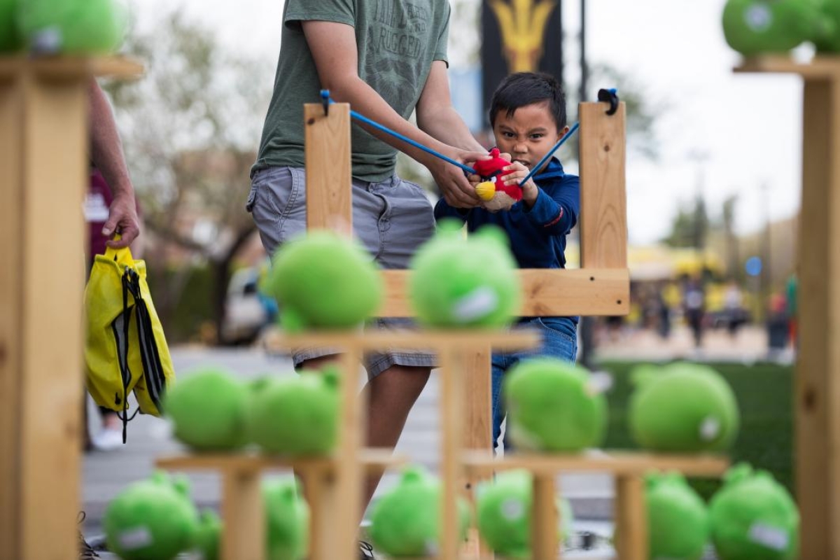 child playing with giant Angry Birds game