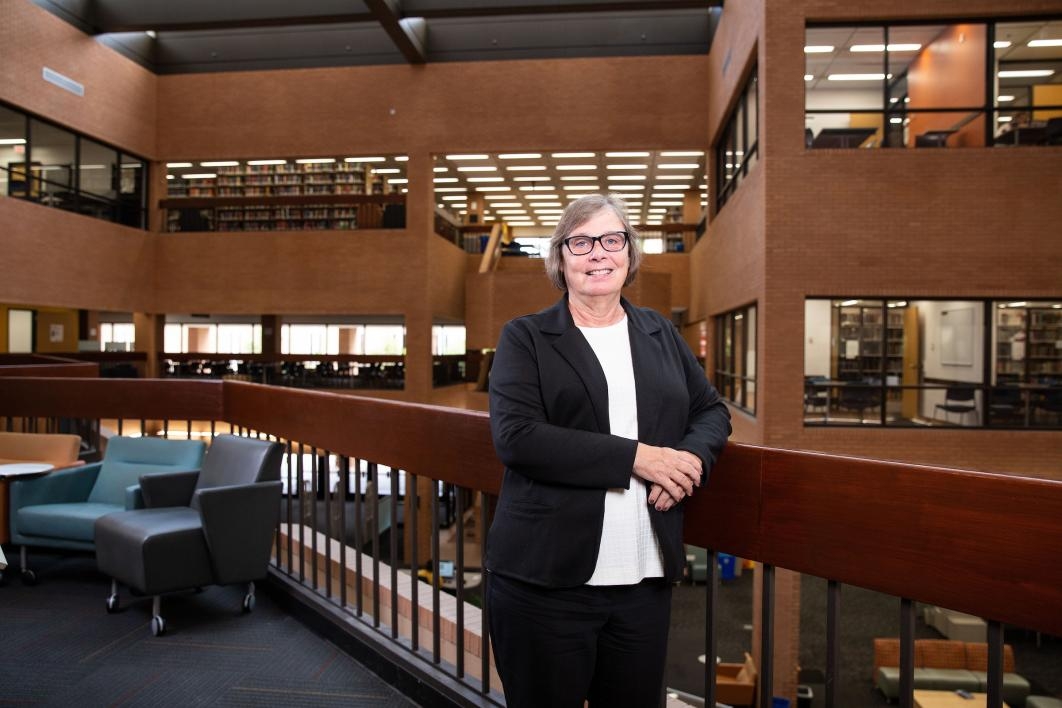 Associate University Librarian Tomalee Doan poses for a portrait in Noble Library